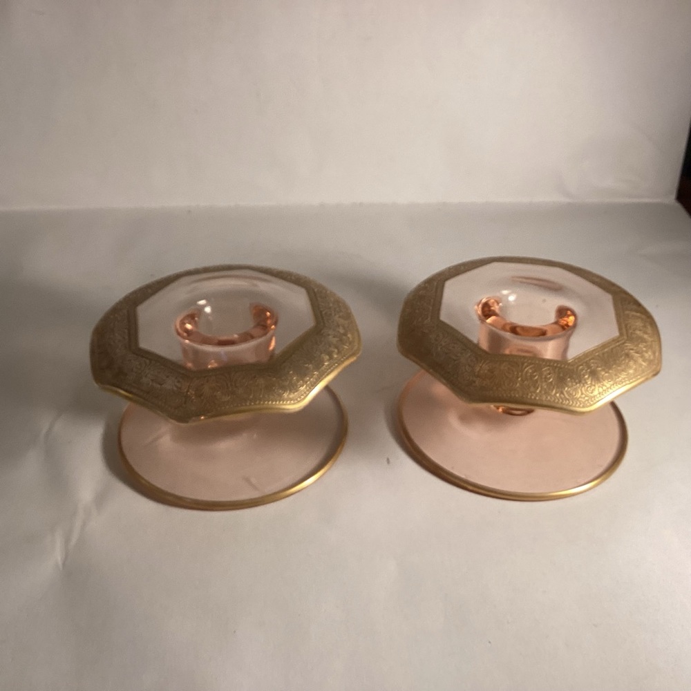 Pair of pink glass candle holders with gold trim